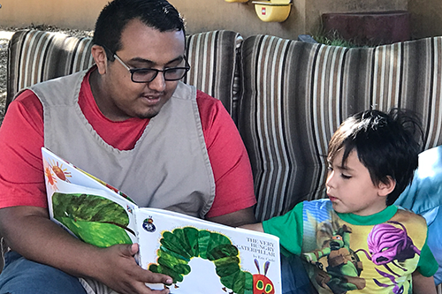 An MJC Student reading to a preschooler as part of the Early Child Development program. 