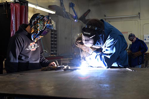  Welding students practicing different welds during class. 